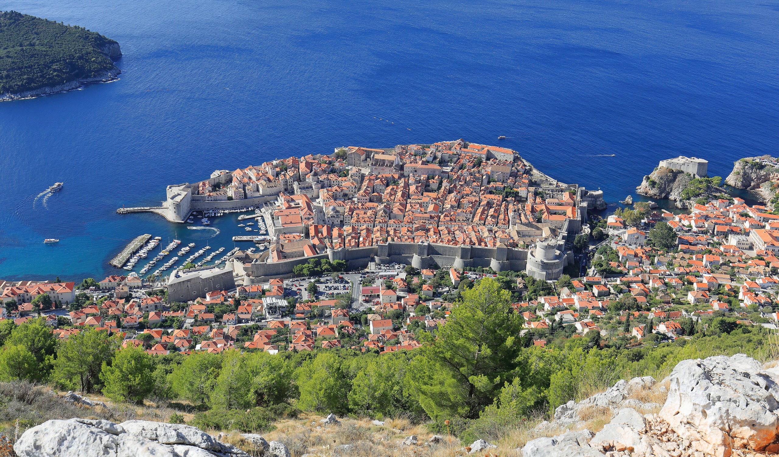 Dubrovnik’s terracotta rooftops, stone walls, and Adriatic coast viewed from Srđ